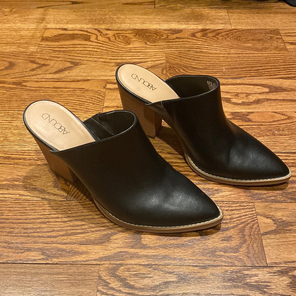 Black slip on mules. Size 7.5